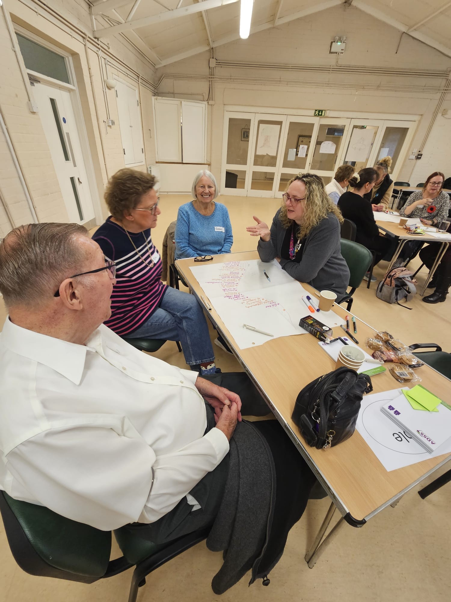 smiling people at a desk