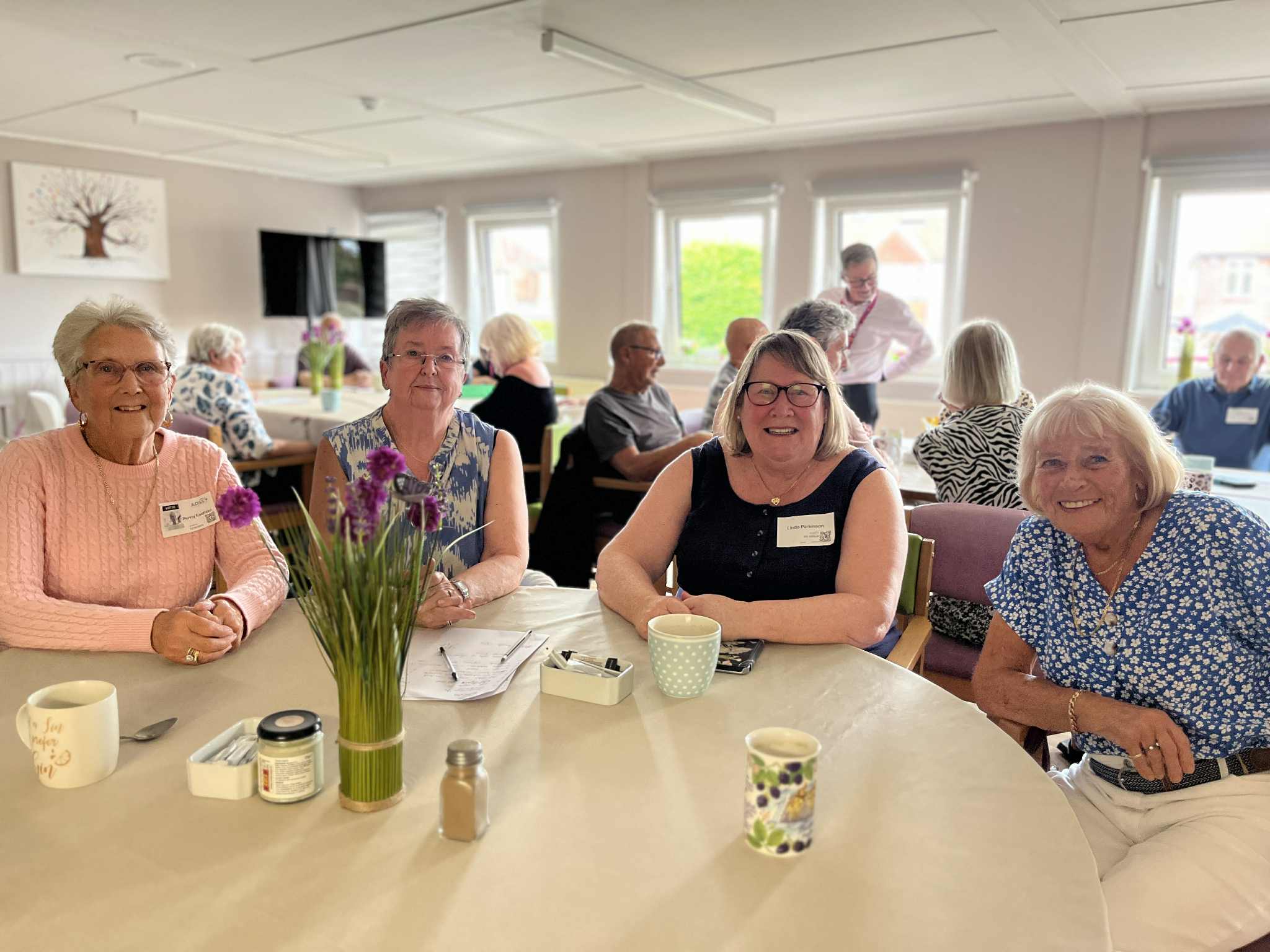 smiling people at a desk