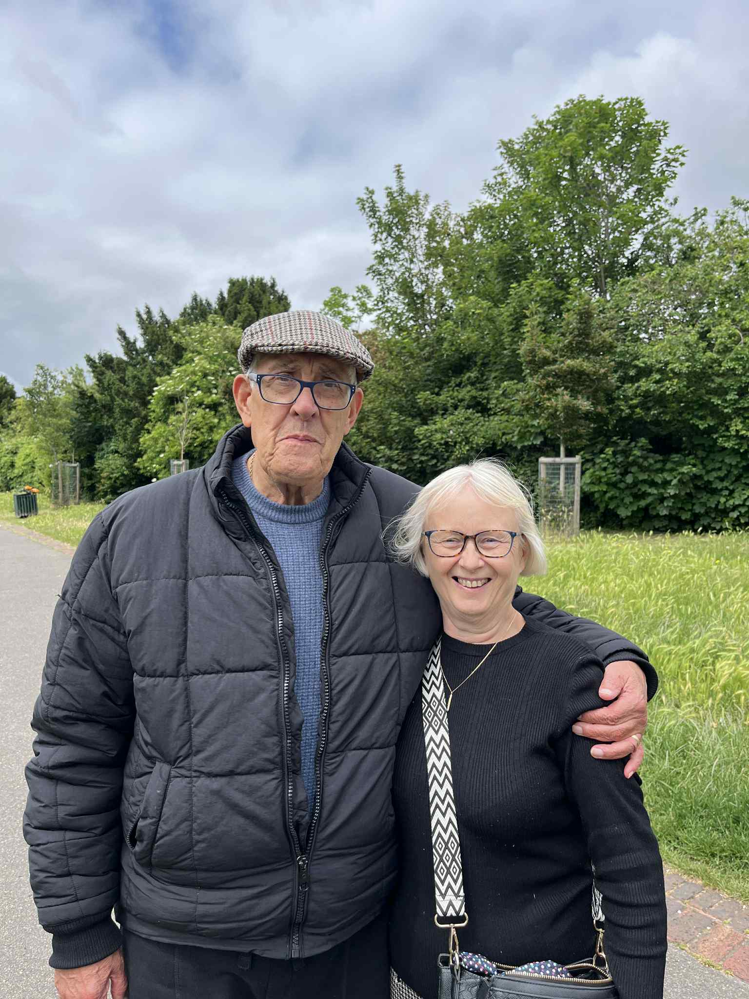 group of people smiling on a street